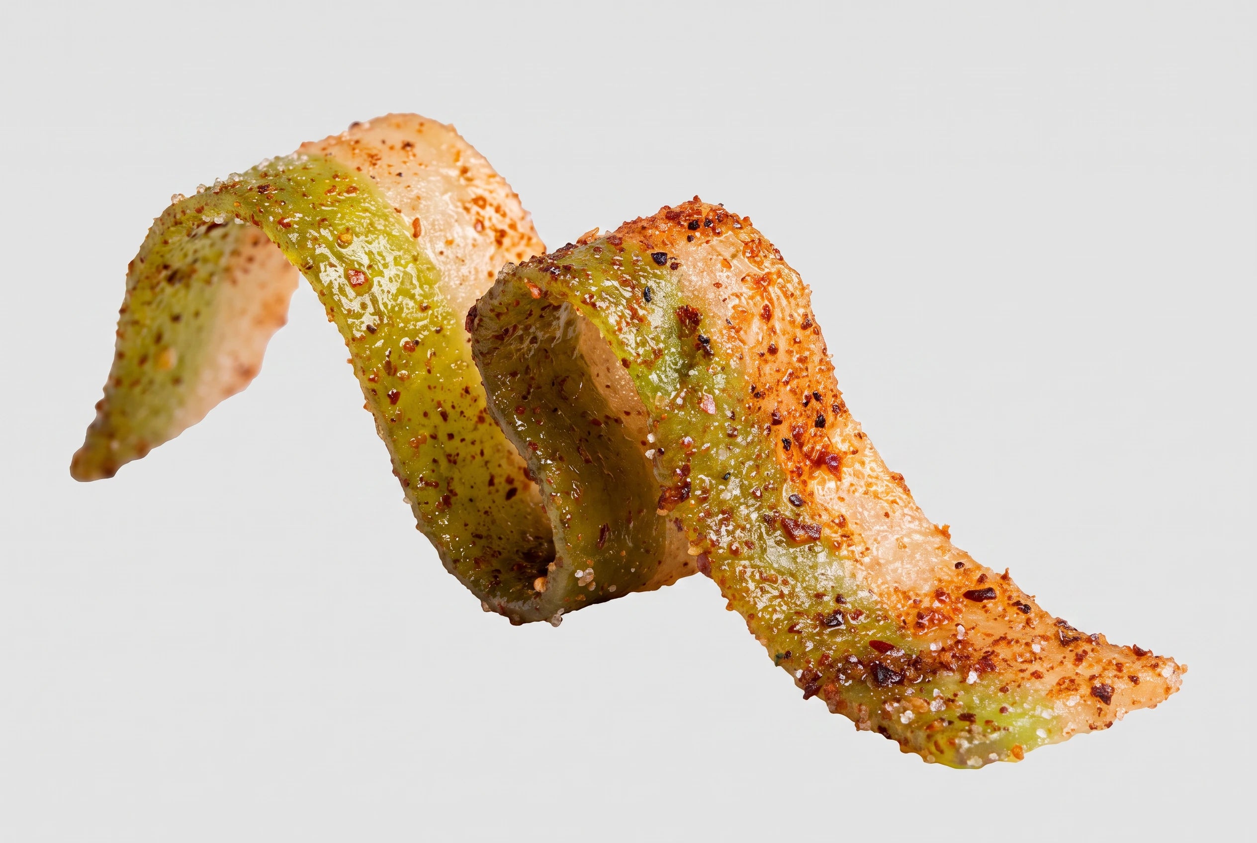 Two-tone Pickle Belt coated in chamoy, chili flakes, and salt