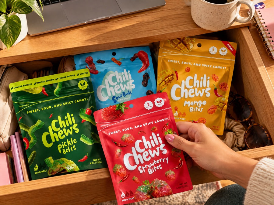 A desk drawer stocked with Chili Chews pouches