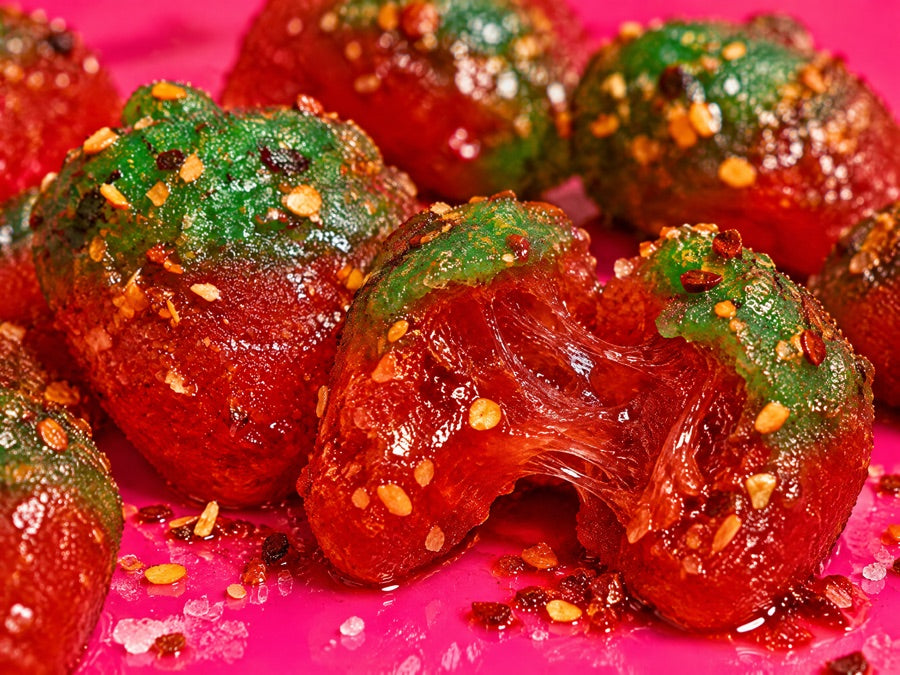 Close-up of chamoy gummies with real chili flakes